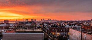 Baltimore, MD Skyline at Sunset with famous rooftop decks in foreground